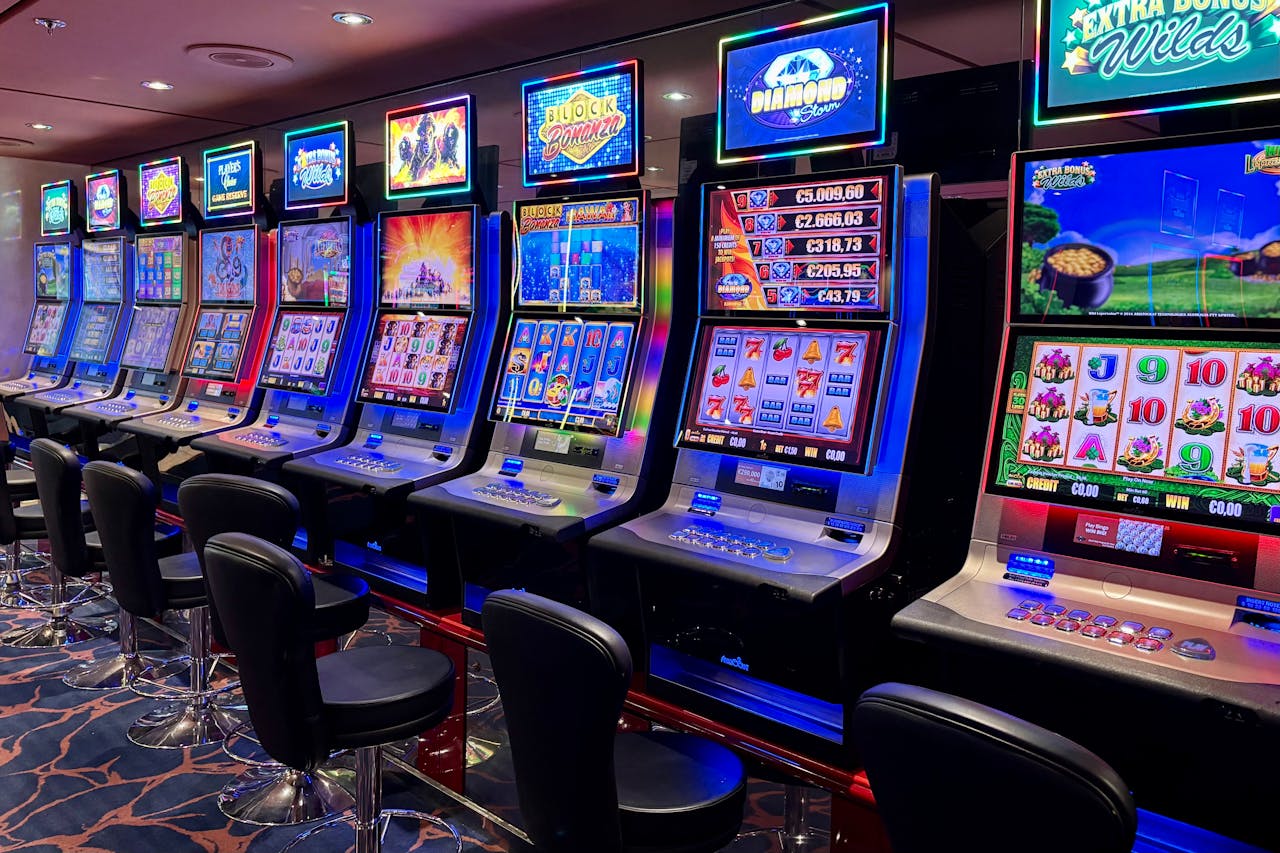 our-experience Bright casino slot machines with colorful displays and no people present.